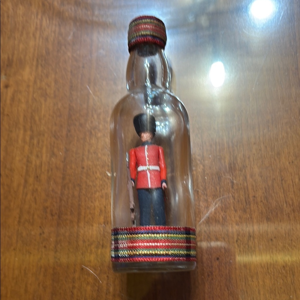 Decorative Bottle with Guard Figurine